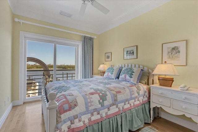 bedroom featuring access to outside, light hardwood / wood-style flooring, and ceiling fan