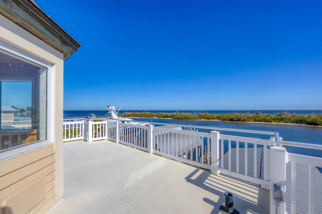 view of patio with a water view