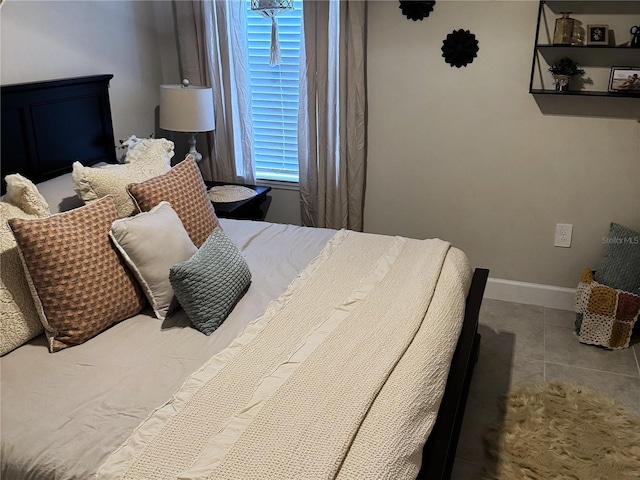 bedroom with light tile patterned flooring