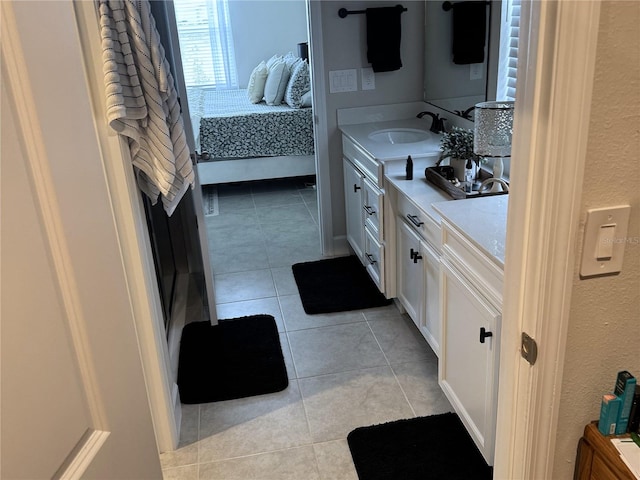 bathroom featuring tile patterned flooring and vanity