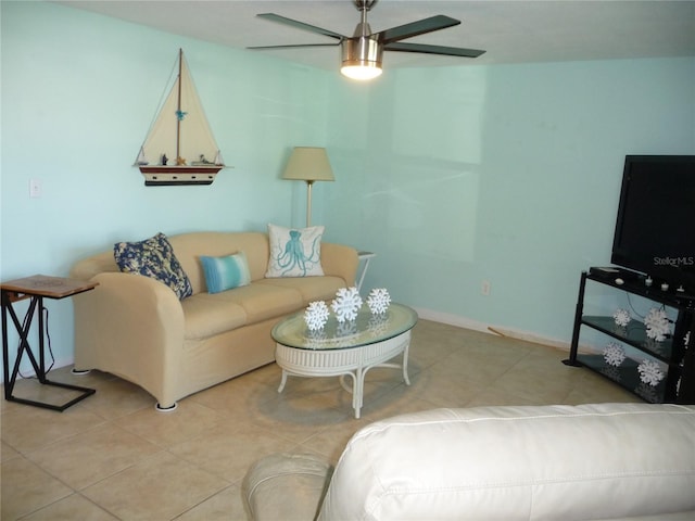 living room with ceiling fan and light tile patterned flooring