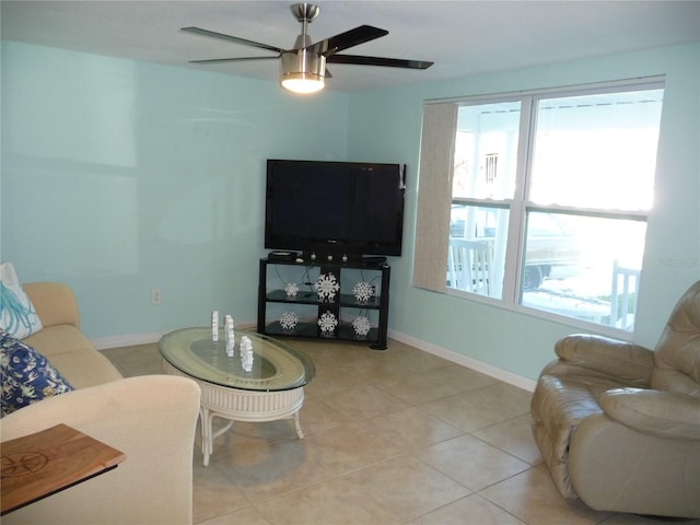 tiled living room with ceiling fan