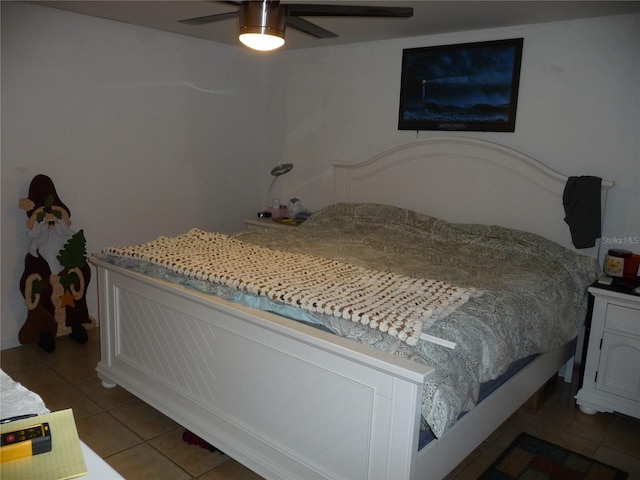 tiled bedroom with ceiling fan