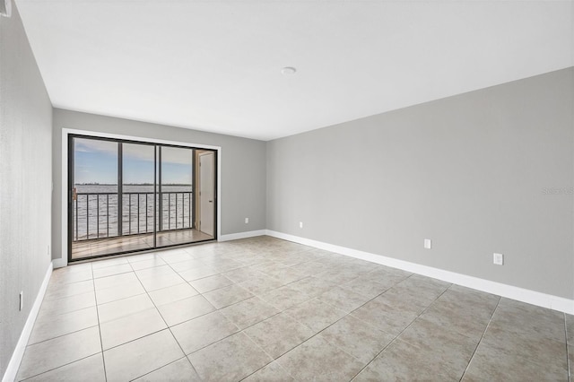 empty room with light tile patterned flooring