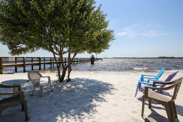 view of patio featuring a water view and a view of the beach