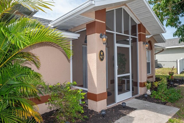 97 Mariner Ln, Rotonda West, FL 33947 - entrance to property featuring stucco siding