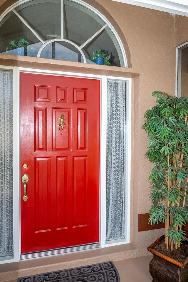 97 Mariner Ln, Rotonda West, FL 33947 - view of exterior entry with stucco siding