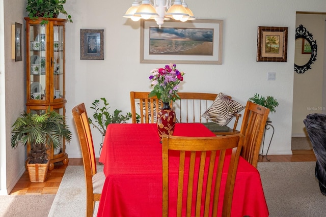 dining space featuring a chandelier