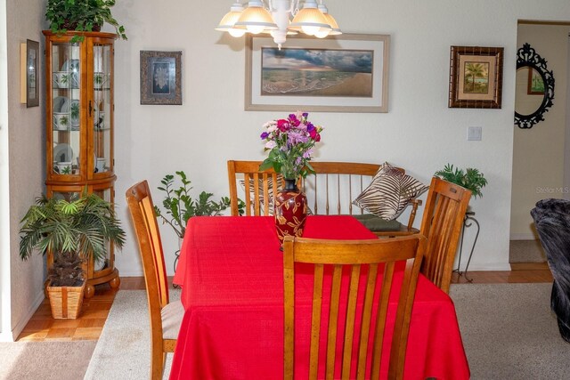 97 Mariner Ln, Rotonda West, FL 33947 - dining room with a chandelier and baseboards