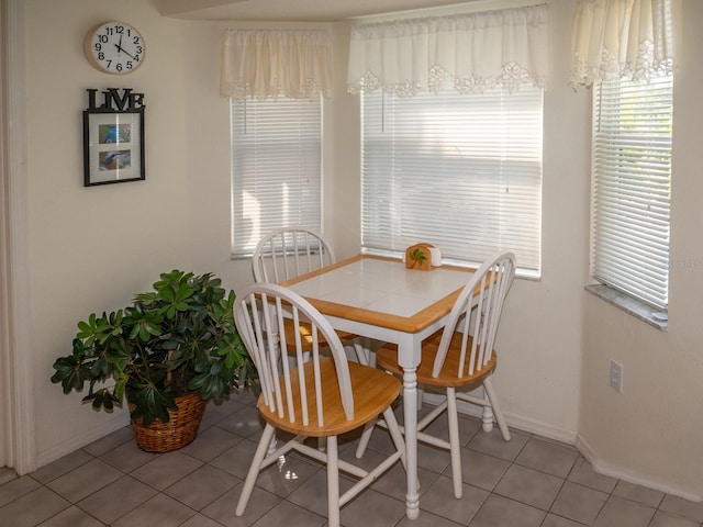 dining room with tile patterned flooring