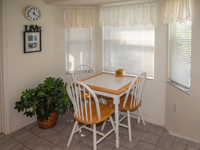 97 Mariner Ln, Rotonda West, FL 33947 - dining space with baseboards and light tile patterned flooring