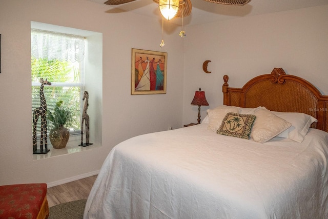 97 Mariner Ln, Rotonda West, FL 33947 - bedroom with wood finished floors and a ceiling fan