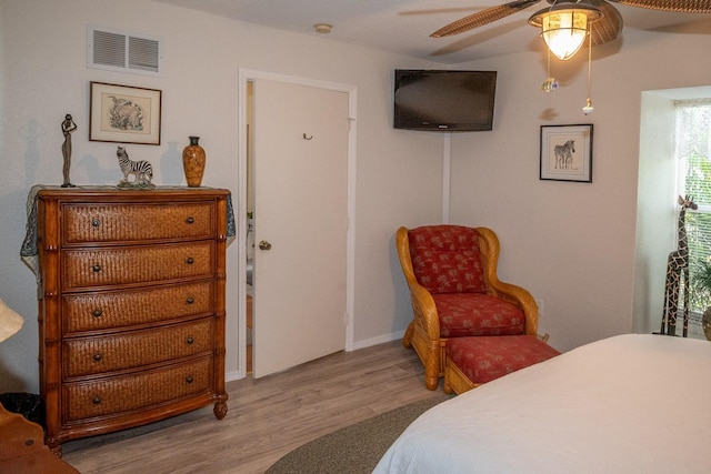 bedroom with ceiling fan and light hardwood / wood-style flooring