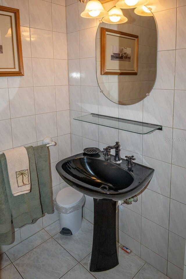 97 Mariner Ln, Rotonda West, FL 33947 - half bathroom with tile walls, tile patterned floors, and toilet