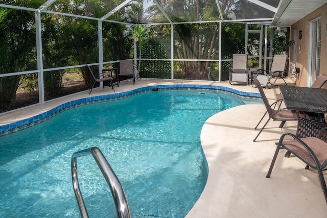 view of pool with a lanai and a patio area