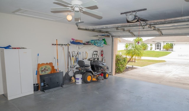 garage with ceiling fan and a garage door opener