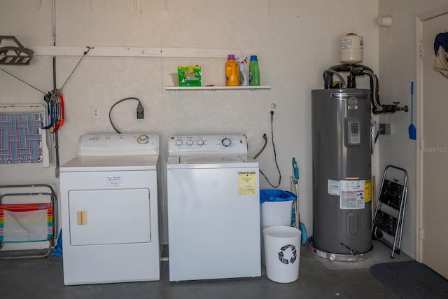 washroom featuring washing machine and clothes dryer and electric water heater