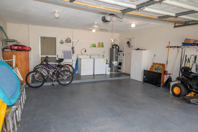 garage with washing machine and dryer, water heater, and ceiling fan