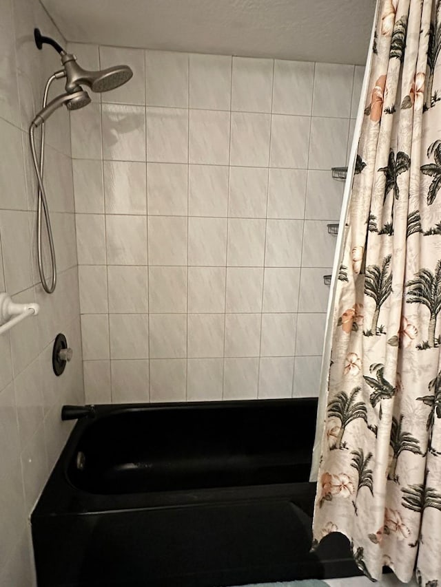 bathroom featuring shower / tub combo with curtain