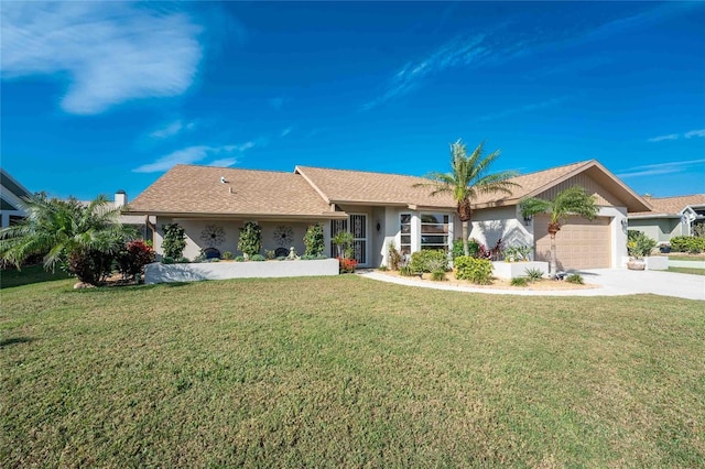 ranch-style house featuring a front yard and a garage