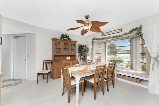 dining area featuring a textured ceiling