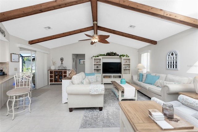 living room featuring vaulted ceiling with beams, ceiling fan, and light tile patterned floors