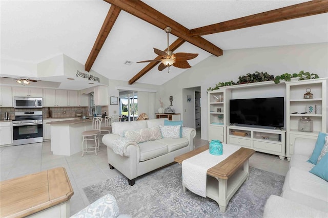 tiled living room featuring lofted ceiling with beams and ceiling fan