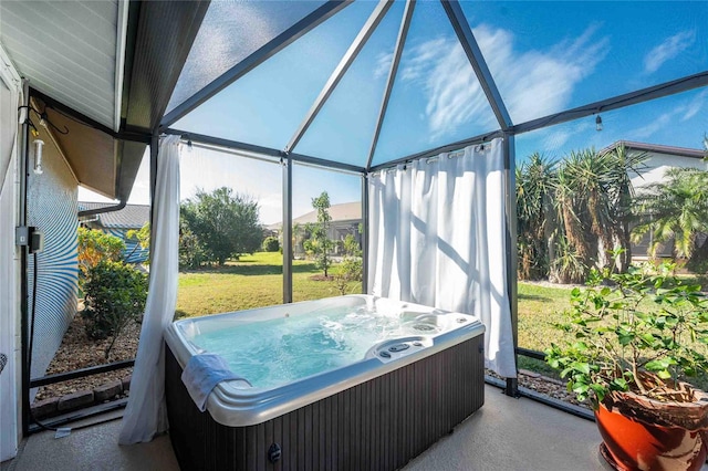 sunroom featuring vaulted ceiling and a hot tub