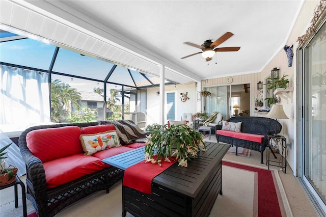 sunroom featuring ceiling fan and a healthy amount of sunlight