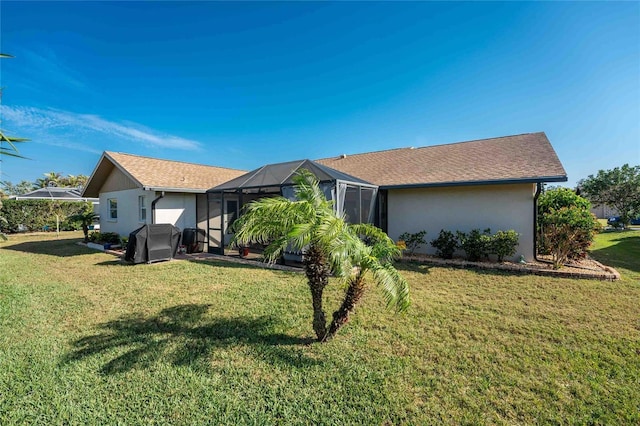 exterior space featuring a yard and a lanai