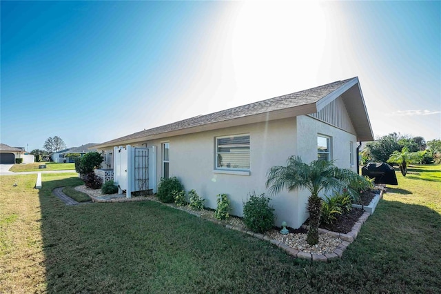 rear view of property with a lawn