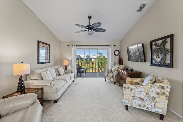 carpeted living room with vaulted ceiling and ceiling fan