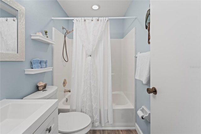 full bathroom with toilet, shower / bath combo with shower curtain, vanity, and hardwood / wood-style flooring