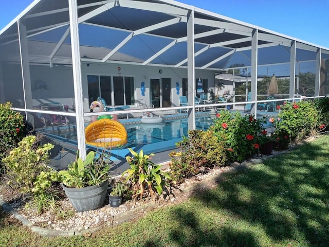 back of house featuring a lanai