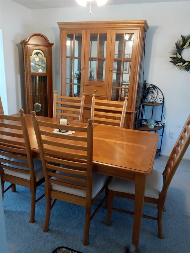 dining room featuring carpet