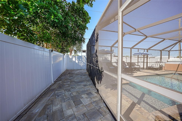 view of patio / terrace with a lanai and a fenced in pool