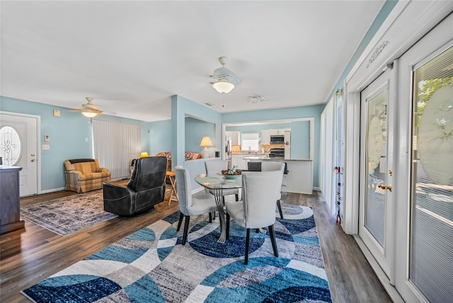 dining room with ceiling fan and hardwood / wood-style floors