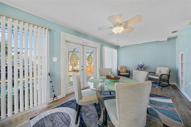 dining room featuring french doors, ceiling fan, and wood-type flooring