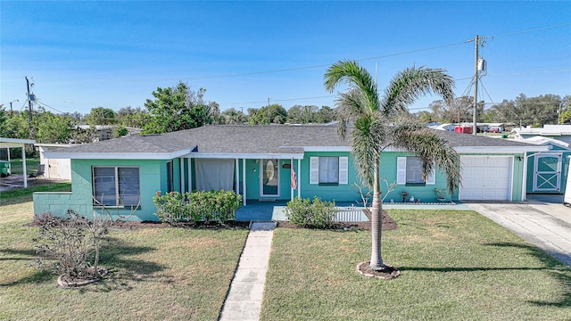 ranch-style home with a garage and a front lawn