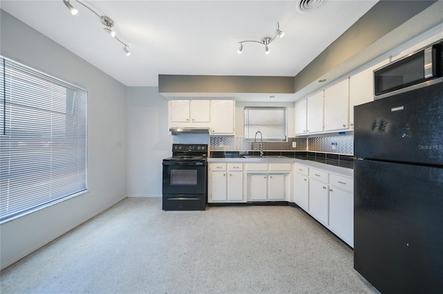 kitchen featuring black appliances, decorative backsplash, white cabinetry, and sink