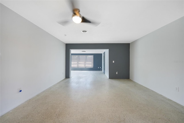 unfurnished room with ceiling fan