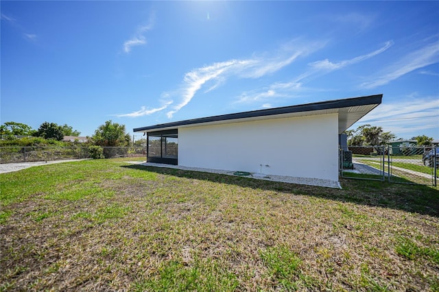 view of home's exterior featuring a lawn