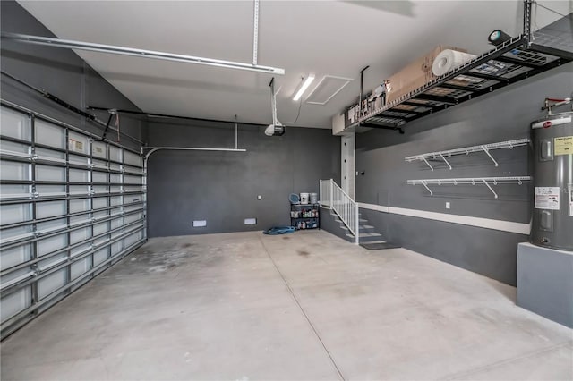 garage featuring a garage door opener and water heater