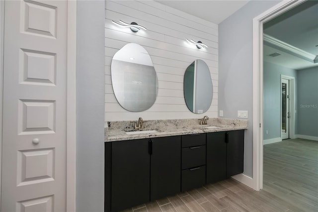 bathroom featuring hardwood / wood-style floors and vanity