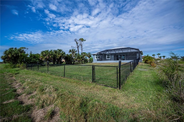 view of yard featuring a rural view and a lanai