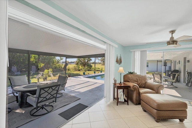 interior space with plenty of natural light, ceiling fan, and a swimming pool