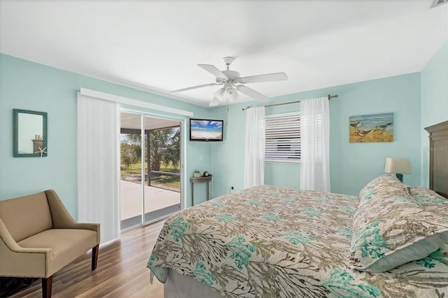 bedroom featuring ceiling fan, light hardwood / wood-style floors, and access to exterior