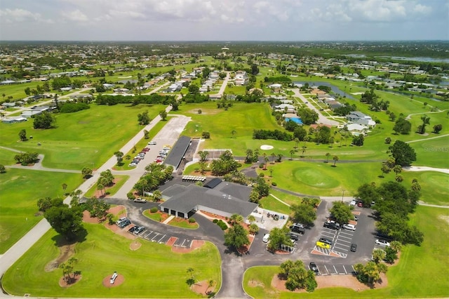 birds eye view of property with view of golf course