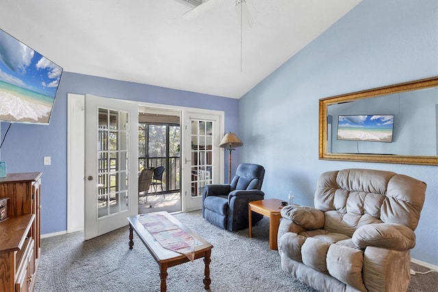 sitting room featuring carpet flooring, french doors, and vaulted ceiling