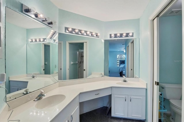 bathroom with vanity and toilet